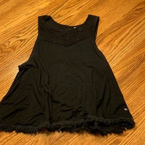 Black tank top with lace and tassel details